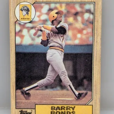 Sale Photo Thumbnail #745: 1987 Topps Barry Bonds rookie baseball card (#320) featuring his signature woodgrain border design.