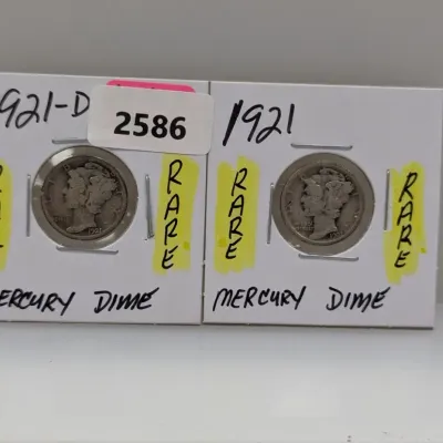 Sale Photo Thumbnail #911: Two key-date US Mercury dimes, including a 1921-D and a 1921, housed in cardboard flips marked "Rare".