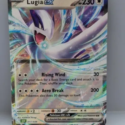 Sale Photo Thumbnail #555: Lugia ex full art holo Pokémon trading card from 2023, featuring 230 HP and special attacks Rising Wind and Aero Break.