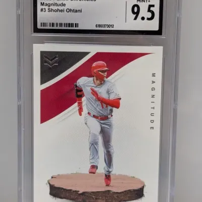 Sale Photo Thumbnail #93: CGC-graded 9.5 Mint+ 2020 Panini Chronicles Magnitude #3 Shohei Ohtani baseball card in a protective case.