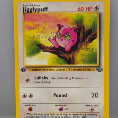 Sale Photo Thumbnail #540: 1st Edition Pokémon Jigglypuff card from the Jungle set, numbered 54/64, copyright 1999.