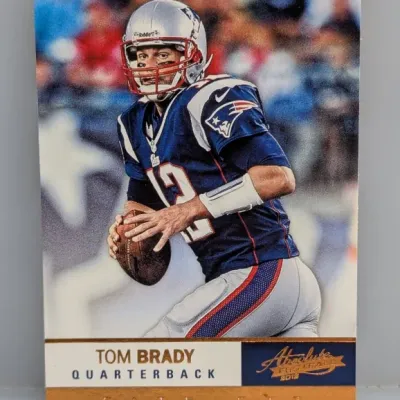 Sale Photo Thumbnail #38: 2013 Panini Absolute Football Tom Brady trading card in good condition, featuring the New England Patriots quarterback in action.