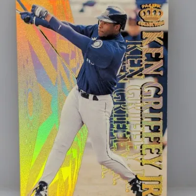 Sale Photo Thumbnail #437: 1997 Pacific Crown Collection Ken Griffey Jr. baseball trading card featuring a holographic foil background.