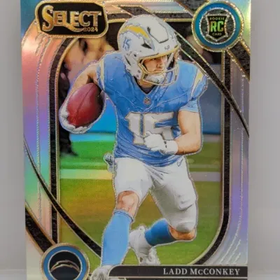 Sale Photo Thumbnail #117: 2024 Panini Select Ladd McConkey rookie football card for the Los Angeles Chargers, featuring a silver Prizm holographic refractor finish in near-mint condition.