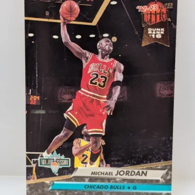 Sale Photo Thumbnail #691: 1992-93 Fleer Ultra Michael Jordan #216 basketball card featuring the Chicago Bulls guard mid-dunk.
