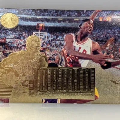 Sale Photo Thumbnail #282: 1998 Upper Deck Michael Jordan Collection Championship '98 trading card J4, featuring gold foil etching and textured metallic finish.