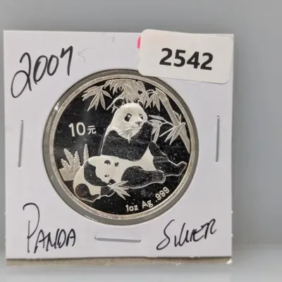 Sale Photo Thumbnail #867: 2007 Chinese Silver Panda 10 Yuan coin, 1 oz .999 fine silver, presented in a cardboard coin flip.