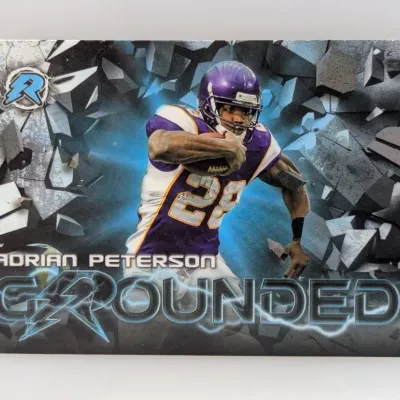 Sale Photo Thumbnail #326: Adrian Peterson Minnesota Vikings "Grounded" football trading card featuring dynamic graphics.