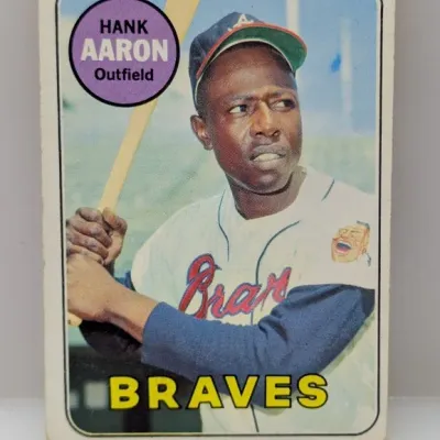 Sale Photo Thumbnail #182: 1968 Topps Hank Aaron #110 baseball card depicting him in his Atlanta Braves uniform, showing minor edge wear.