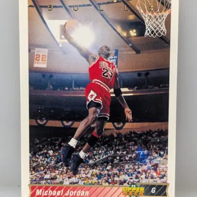 Sale Photo Thumbnail #443: 1992-93 Upper Deck Michael Jordan basketball card #23, featuring an iconic photo of Jordan dunking.