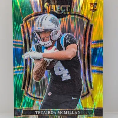 Sale Photo Thumbnail #312: 2025 Panini Select Tetairoa McMillan rookie card featuring a vibrant green, yellow, and blue holographic refractor finish.