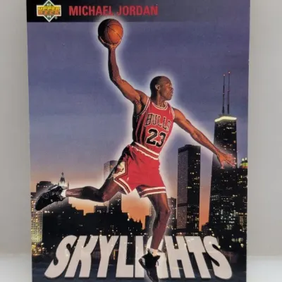 Sale Photo Thumbnail #562: 1993-94 Upper Deck Michael Jordan Skylights basketball card depicting the player dunking against the Chicago skyline.