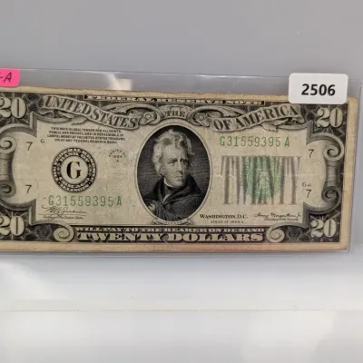 Sale Photo Thumbnail #831: Series 1934-A $20 Federal Reserve Note from Chicago, enclosed in a protective currency sleeve.