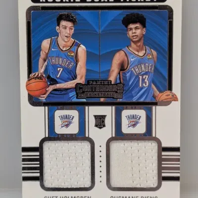 Sale Photo Thumbnail #269: 2022-23 Panini Contenders Rookie Dual Ticket trading card featuring Chet Holmgren and Ousmane Dieng of the Oklahoma City Thunder with player-worn jersey memorabilia swatches.