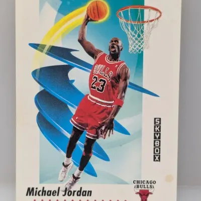 Sale Photo Thumbnail #279: 1990-91 SkyBox Michael Jordan Chicago Bulls #41 trading card featuring dynamic artwork of a slam dunk.