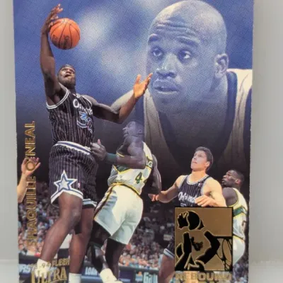 Sale Photo Thumbnail #315: 1993-94 Fleer Ultra Shaquille O'Neal Rebound King insert trading card featuring gold foil accents.
