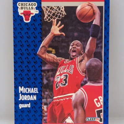 Sale Photo Thumbnail #512: 1990-91 Fleer Michael Jordan #29 trading card featuring the Chicago Bulls guard preparing to dunk.