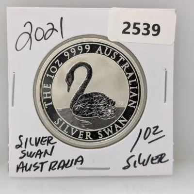 Sale Photo Thumbnail #864: 2021 1 oz .9999 fine Australian Silver Swan bullion coin housed in a protective card holder.