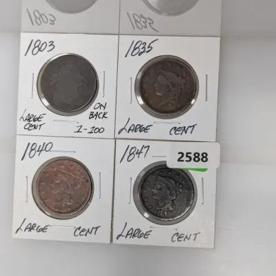 Sale Photo Thumbnail #913: Collection of four US Large Cents in cardboard flips, dated 1803, 1835, 1840, and 1847.