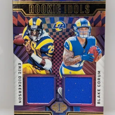 Sale Photo Thumbnail #110: Panini Illusions 'Rookie Idols' dual memorabilia trading card featuring Los Angeles Rams running backs Eric Dickerson and Blake Corum, inset with two blue jersey swatches.