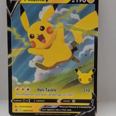 Sale Photo Thumbnail #674: Pokémon Pikachu V promo card SWSH143 featuring full-art artwork and a 25th anniversary stamp, dated 2021.