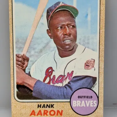 Sale Photo Thumbnail #151: 1968 Topps Hank Aaron baseball card #110, featuring the Atlanta Braves outfielder with a burlap border design.