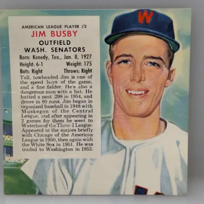 Sale Photo Thumbnail #297: Vintage 1955 Johnston Cookies Jim Busby baseball card depicting him in his Washington Senators uniform with bio text on the left.