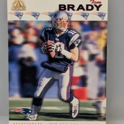 Sale Photo Thumbnail #319: Tom Brady Adrenaline trading card depicting him in his New England Patriots uniform.