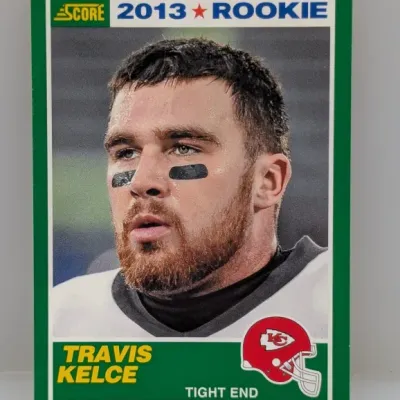 Sale Photo Thumbnail #142: 2013 Score Travis Kelce rookie football card, featuring the Kansas City Chiefs tight end in good condition with crisp edges.