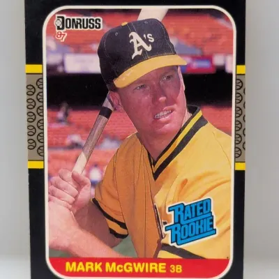 Sale Photo Thumbnail #709: 1987 Donruss Rated Rookie Mark McGwire #36 baseball card featuring the Oakland Athletics slugger.