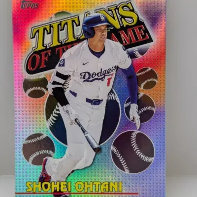 Sale Photo Thumbnail #575: Topps Shohei Ohtani 'Titans of the Game' insert trading card featuring Ohtani in a Los Angeles Dodgers uniform with a colorful refractor background.