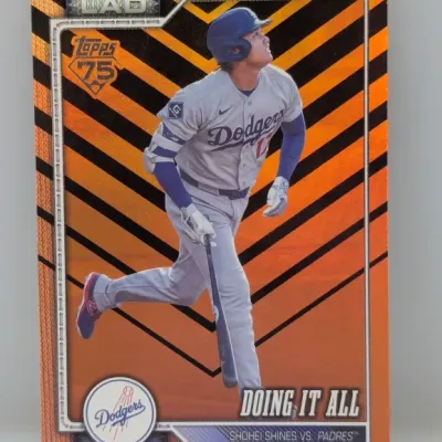 Sale Photo Thumbnail #433: Topps Shohei Ohtani 'Doing It All' Los Angeles Dodgers trading card featuring an orange parallel background.