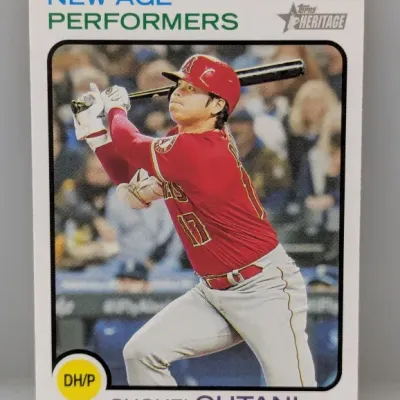Sale Photo Thumbnail #407: Topps Heritage 'New Age Performers' Shohei Ohtani trading card featuring him in a Los Angeles Angels uniform, presented in near-mint condition.