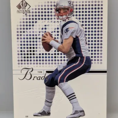 Sale Photo Thumbnail #333: 2000 SP Authentic Tom Brady rookie trading card featuring the quarterback in his New England Patriots uniform.