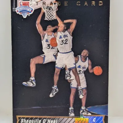 Sale Photo Thumbnail #649: 1992-93 Upper Deck Trade Card featuring Shaquille O'Neal in his Orlando Magic uniform, showing light wear along the top edge.