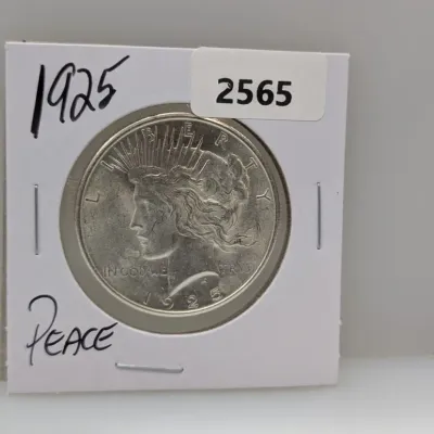 Sale Photo Thumbnail #890: 1925 Peace silver dollar coin in a cardboard flip holder.