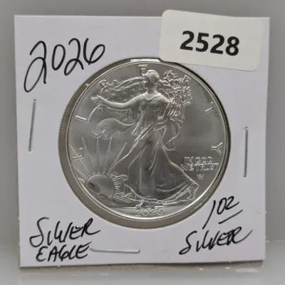 Sale Photo Thumbnail #853: 2020 American Silver Eagle 1 oz fine silver coin, housed in a cardboard flip holder.