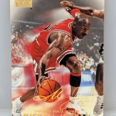 Sale Photo Thumbnail #771: 1997-98 Fleer Premium Michael Jordan basketball trading card #1 featuring gold foil branding and facsimile signature.