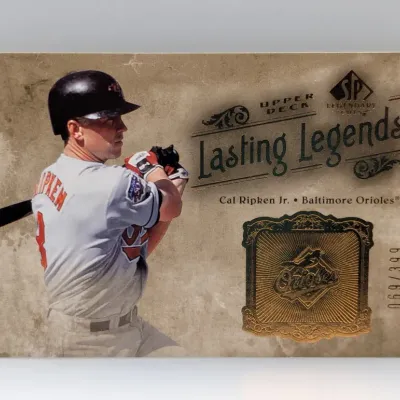 Sale Photo Thumbnail #458: Upper Deck SP Legendary Cuts 'Lasting Legends' Cal Ripken Jr. baseball card, serial numbered 069/399 with an embedded gold-tone Orioles crest logo.