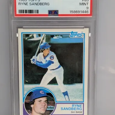 Sale Photo Thumbnail #14: PSA-graded 9 Mint 1983 Topps Ryne Sandberg rookie baseball card (#83) in protective slab.