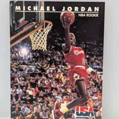 Sale Photo Thumbnail #305: 1991-92 SkyBox USA Basketball Michael Jordan trading card, featuring an iconic dunk shot in his Chicago Bulls uniform.