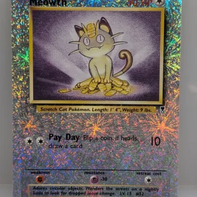 Sale Photo Thumbnail #51: 2002 Pokémon Legendary Collection Meowth reverse foil trading card (#53/110). Features the distinctive firework-style holographic finish across the card surface.