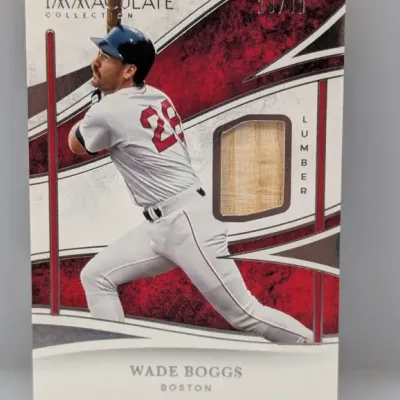 Sale Photo Thumbnail #451: Panini Immaculate Collection Wade Boggs baseball card featuring an embedded game-used bat relic, serial numbered 18/49.