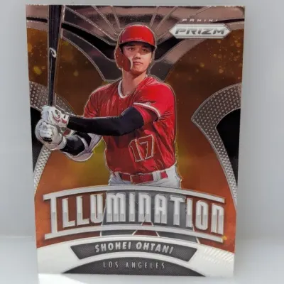 Sale Photo Thumbnail #334: Panini Prizm Illumination Shohei Ohtani baseball trading card featuring him in a red Los Angeles uniform.