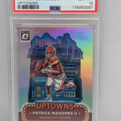 Sale Photo Thumbnail #30: PSA 10 Gem Mint 2024 Donruss Optic Uptowns #20 Patrick Mahomes II trading card in a protective slab.