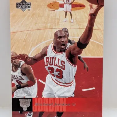 Sale Photo Thumbnail #661: Upper Deck Michael Jordan #23 Chicago Bulls basketball trading card depicting an action shot on the court.