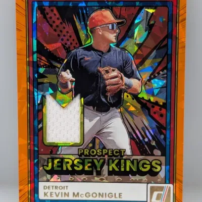 Sale Photo Thumbnail #448: Panini Donruss Prospect Jersey Kings Kevin McGonigle baseball card featuring an orange parallel border, colorful mosaic refractor design, and embedded jersey swatch.