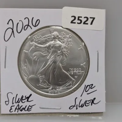 Sale Photo Thumbnail #852: 2026 American Silver Eagle 1 oz silver coin, mounted in a cardboard protective coin flip.