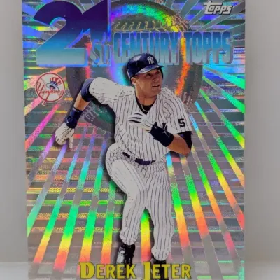 Sale Photo Thumbnail #493: 1999 Topps 21st Century Topps Derek Jeter holographic baseball card. Features a vibrant foil burst design with the New York Yankees logo.