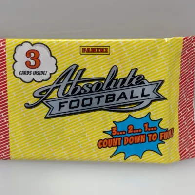 Sale Photo Thumbnail #508: Unopened Panini Absolute Football trading card pack containing three cards in bright yellow, red, and blue wrapper graphics.